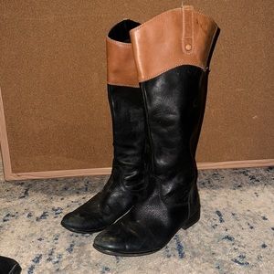 Black and brown tall boots